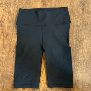 Lululemon shorts with net design. 8” Never worn